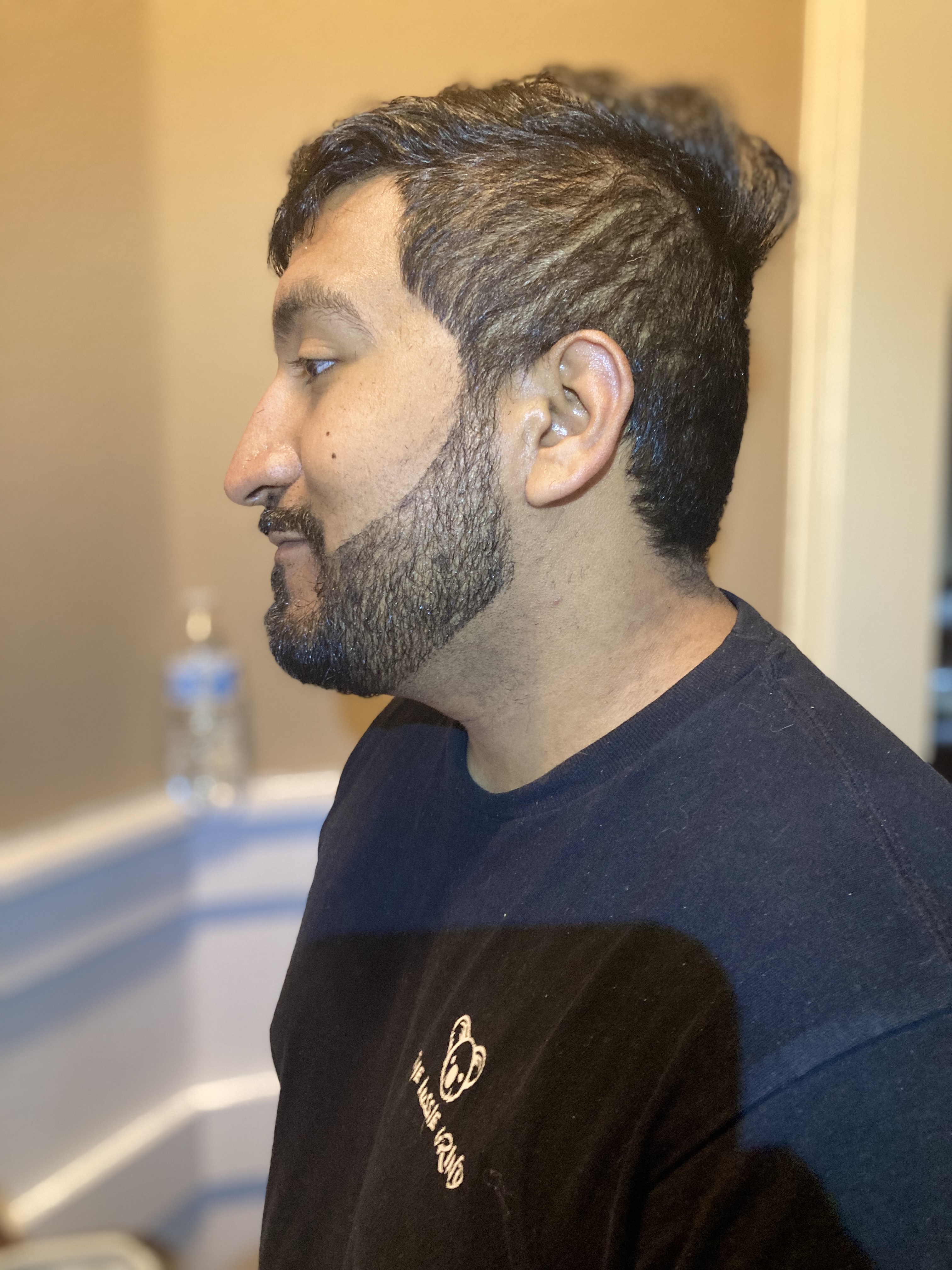 Styled hair with groomed beard