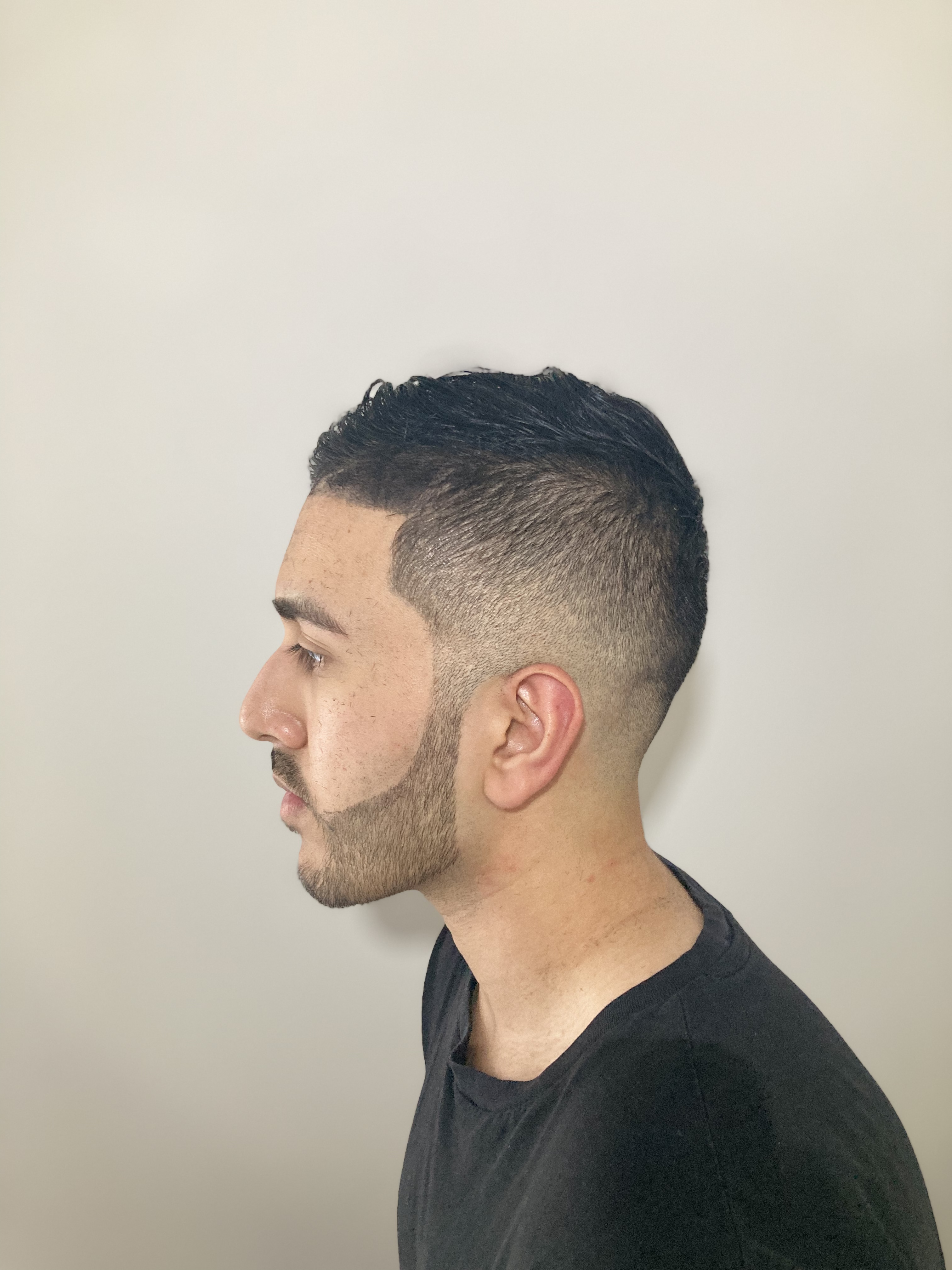 Skin fade with lined-up beard